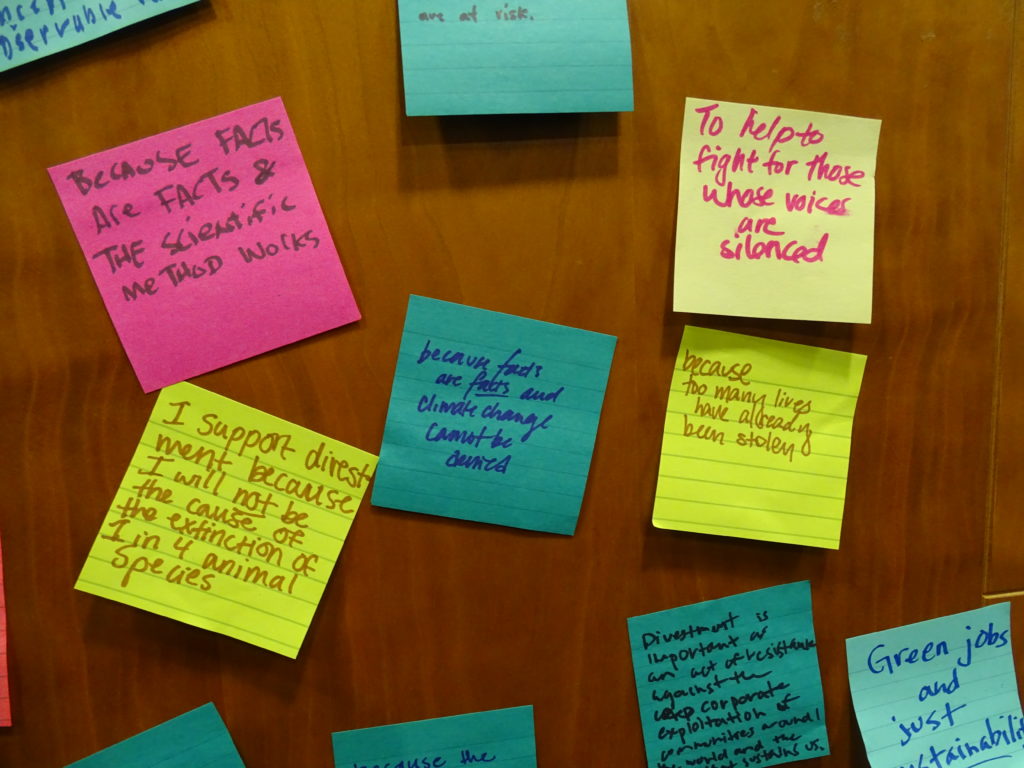 PHoto: post-it notes calling for divestment.